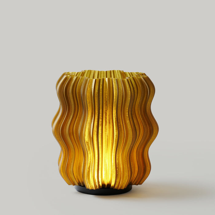 Cordless Mini Wavy LampA little lamp with strong opinions about atmosphere.
Please note: Colors appear less bright than Clear as the filament is darker and more opaque.
Scaled down but noWooj DesignCordless Mini Wavy LampHomeTech Hub
